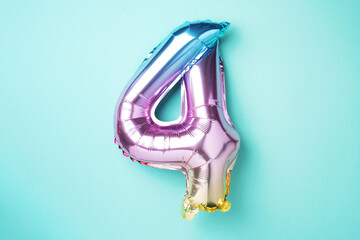 Creative layout. Rainbow foil balloon number and digit four 4. Birthday greeting card. Anniversary...