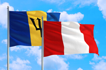 Peru and Barbados national flag waving in the windy deep blue sky. Diplomacy and international relations concept.