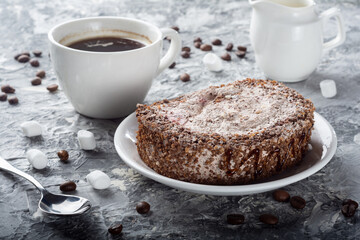 Sponge chocolate cake. Sweets with coffee. Sponge cake with delicate chocolate cream.