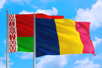 Chad and Belarus national flag waving in the windy deep blue sky. Diplomacy and international relations concept.