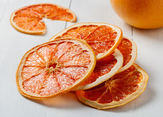 slices of dried grapefruit on a white old table