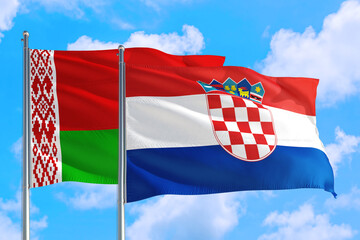 Croatia and Belarus national flag waving in the windy deep blue sky. Diplomacy and international relations concept.