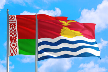 Fototapeta na wymiar Kiribati and Belarus national flag waving in the windy deep blue sky. Diplomacy and international relations concept.