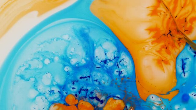 beautiful colored abstract background of moving and mixing liquid paints on water surfacered, painted texture. Multicolored acrylic paint.ed acrylic paint.
