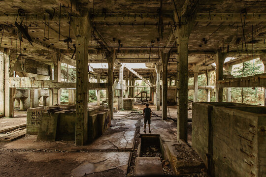 View of abandoned empty buildings of old tin mine. Industrial dirty building interior. Damaged factory in Rolava, Ore mountains,Czech republic