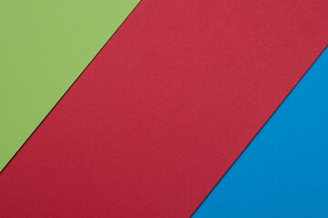 Geometrical texture with green, red and blue school papers. RGB colors