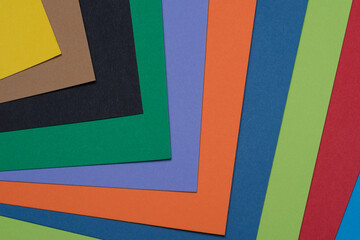 Multicolored bristol paper stack. Back to school concept - obrazy, fototapety, plakaty