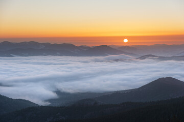 Winter in the Ukrainian Carpathian mountains with morning fogs