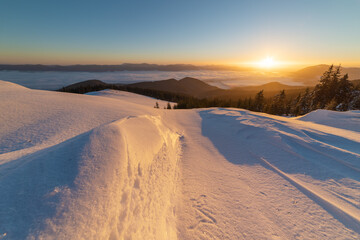Winter in the Ukrainian Carpathian mountains with morning fogs