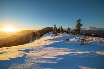 Winter in the Ukrainian Carpathian mountains with morning fogs