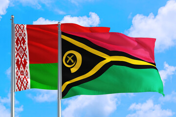 Vanuatu and Belarus national flag waving in the windy deep blue sky. Diplomacy and international relations concept.