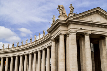 Fototapeta na wymiar Architectural detail of the doric columns that surround Saint Peter's Square, in Vatican.