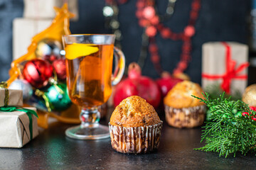 muffin sweet dessert christmas cupcakes and cup of tea festive table setting holidays new year gift tasty top view copy space food background rustic