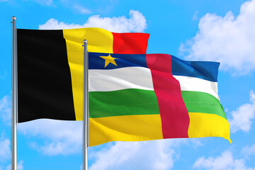 Central African Republic and Belgium national flag waving in the windy deep blue sky. Diplomacy and international relations concept.