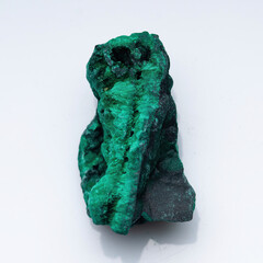 Malachite green ore on a white background. Natural green malachite