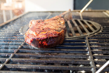 Dry Aged Barbecue Tomahawk Steak on grill
