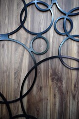 black wrought iron on wood panel