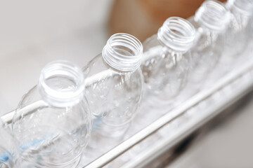 Production of PET plastic bottles on conveyor belt milk and water factory
