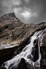 water fall in the mountains. winter landscape