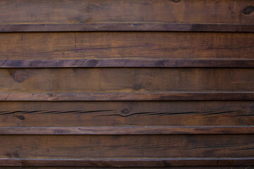 Obraz premium The texture of the boards is dark brown.