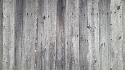 Old gray boards. A panel made of old weathered sedges. Wooden vintage background