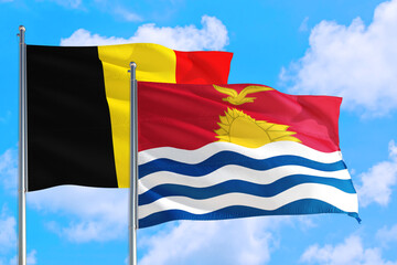 Kiribati and Belgium national flag waving in the windy deep blue sky. Diplomacy and international relations concept.