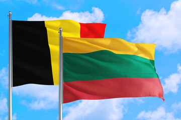 Lithuania and Belgium national flag waving in the windy deep blue sky. Diplomacy and international relations concept.