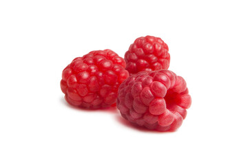 Ripe fresh raspberries isolated on white background