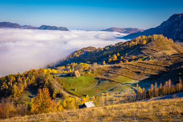 Autumn landscape seen from above with fog in the background