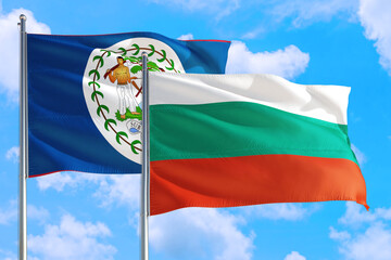 Bulgaria and Belize national flag waving in the windy deep blue sky. Diplomacy and international relations concept.