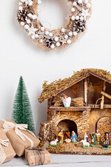 Christmas hygge interior with christmas nativity scene with holy family