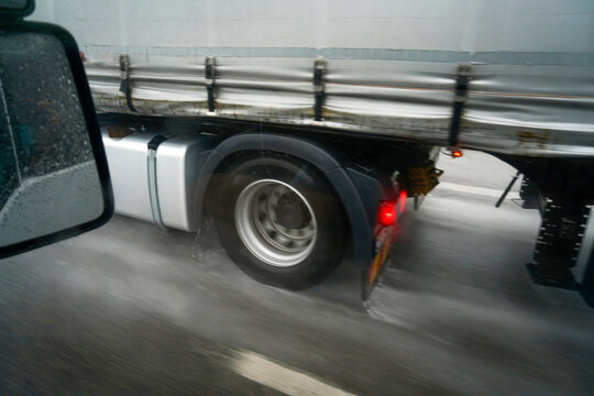 Detail shot of a truck in the rain on the highway © helfei