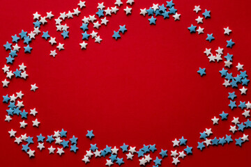 red christmas background with white and blue stars