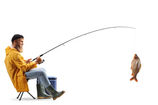 Full length profile shot of a young fisherman sitting on a chair and catching fish