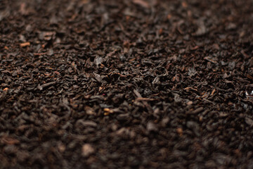 Dried leaves of ceylon black leafy tea, close up.