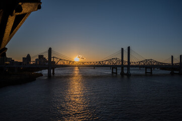 Fototapeta na wymiar Sunset with bridge silhouette Louisville Kentucky
