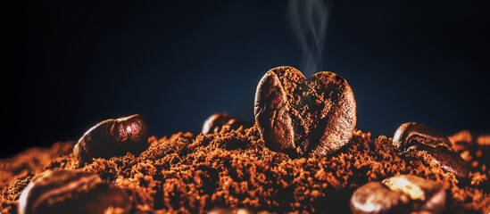 Coffee bean in the form of heart with aromatic smoke from copies of space.