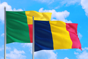 Chad and Benin national flag waving in the windy deep blue sky. Diplomacy and international relations concept.