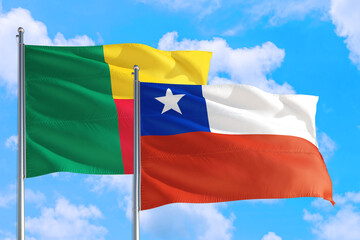 Chile and Benin national flag waving in the windy deep blue sky. Diplomacy and international relations concept.