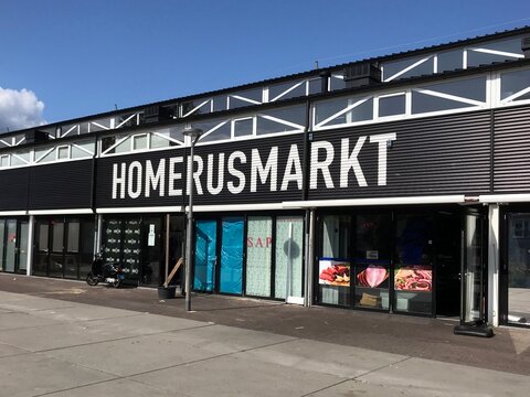 Almere, the Netherlands - September 8, 2019: Entrance and wall logo of  the Homerusmarkt, a covered market in Almere Poort.