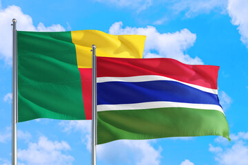 Gambia and Benin national flag waving in the windy deep blue sky. Diplomacy and international relations concept.