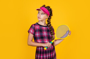 teen girl in fitness cap holding tennis or badminton racket, sport