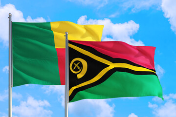 Vanuatu and Benin national flag waving in the windy deep blue sky. Diplomacy and international relations concept.