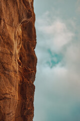 cloudy blue sky with rock