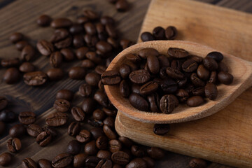 Coffee beans on spoon close up