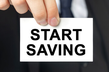 Businessman shows a card with the text START SAVING