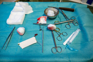 the used sterile instruments are on an operating table after screw removal