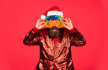 Party entertainment. Christmas spirit. Cheerful clown colorful hairstyle. Funny man with beard....