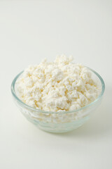 A glass bowl with cotton cheese