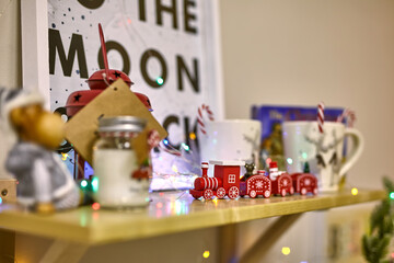 wooden shelf on which stands Christmas decor